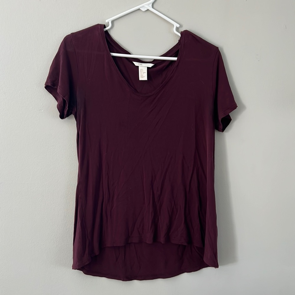 Small scoop neck basic shirt. Lower in back than front